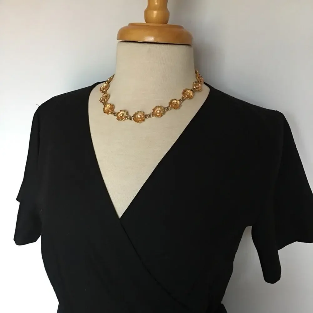 Vintage gold tone flower chain necklace with rhinestone accents